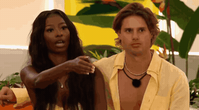 Man And Woman Standing Next To Each Other GIF