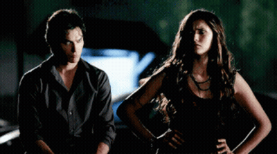 Man And Woman Standing Next To Each Other GIF