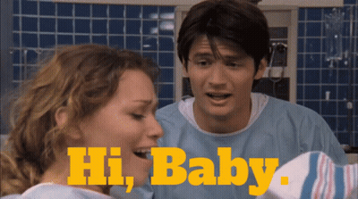 Man And Woman Standing Next To Each Other Saying Hi Baby GIF