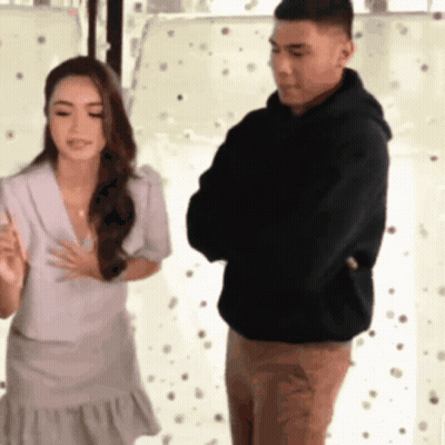 Man And Woman Standing Next To Each Other GIF