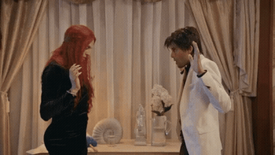 Man And Woman Standing Next To Each Other GIF