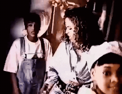 Man And Woman Standing Next To Each Other Woman In Overalls GIF