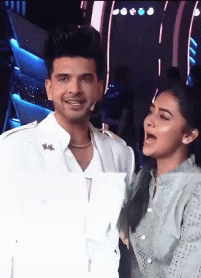 Man And Woman Standing Next To Each Other Woman Singing GIF