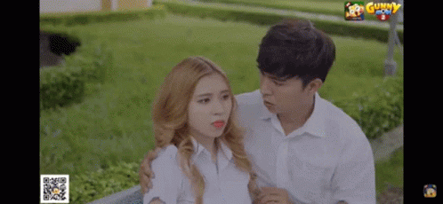 Man And Woman Standing Next To Gunny GIF