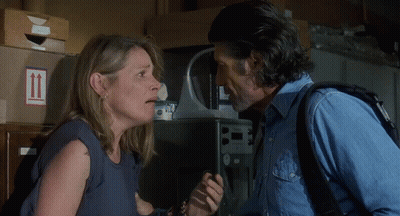 Man And Woman Standing Next To Stack Of Boxes Number 11 GIF