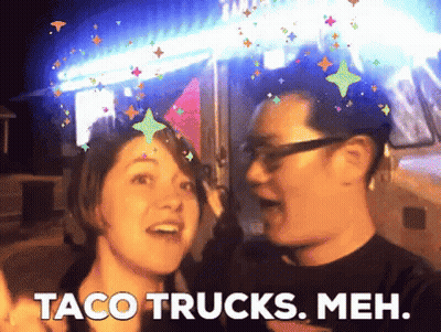 Man And Woman Standing Next To Taco Trucks Meh GIF