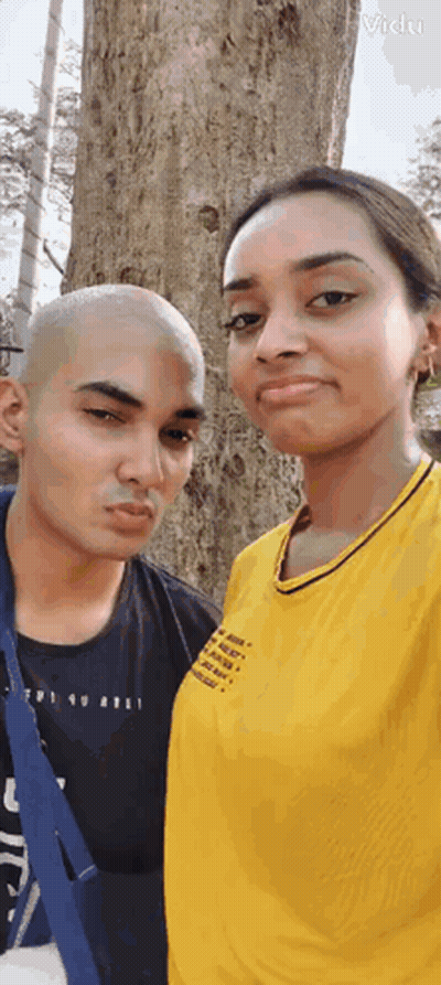 Man And Woman Standing Next To Tree GIF