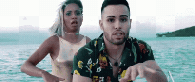 Man And Woman Standing On Boat In Ocean GIF