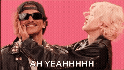 Man And Woman Standing On Pink Background Man Wearing Sunglasses GIF