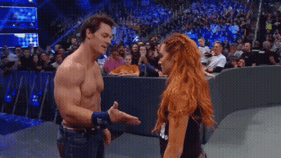 Man And Woman Standing On Stage GIF