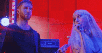 Man And Woman Standing On Stage GIF