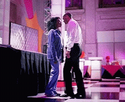 Man And Woman Standing On Stage GIF