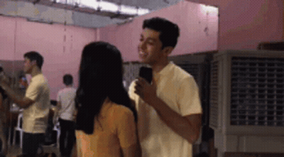 Man And Woman Standing Side By Side GIF