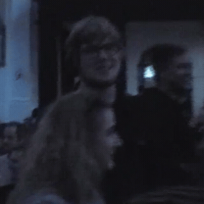 Man And Woman Standing Together In Dark Room GIF
