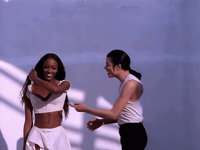 Man And Woman Standing Together Laughing GIF
