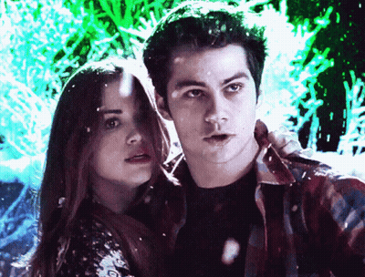 Man And Woman Standing Together Looking At Camera GIF