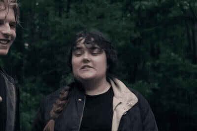 Man And Woman Standing Together Woman In Black Jacket GIF