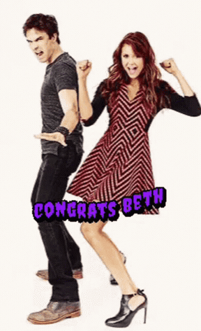 Man And Woman Standing Together Woman In Chevron Dress GIF