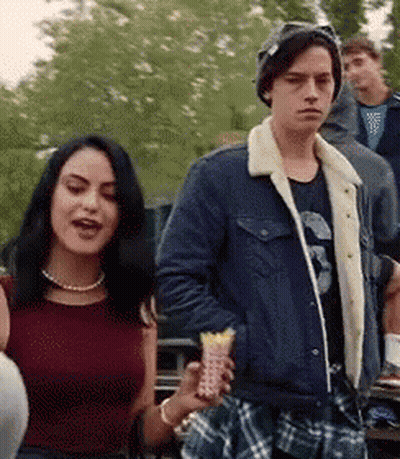 Man And Woman Standing Together Woman With Pearl Necklace GIF
