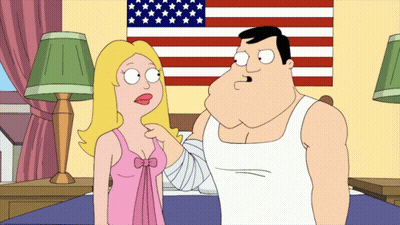 Man And Woman Standing With American Flag GIF