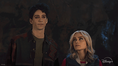 Man And Woman Standing With Disney Logo GIF