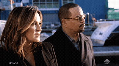 Man And Woman Standing With NBC Logo GIF