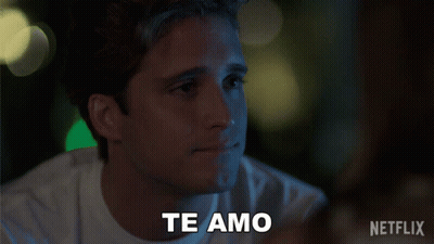 Man And Woman Standing With Perdoname Text GIF