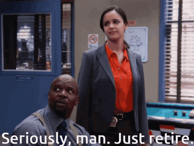 Man And Woman Standing With Seriously Man Just Retire GIF