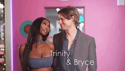 Man And Woman Standing With Trinity And Bryce GIF