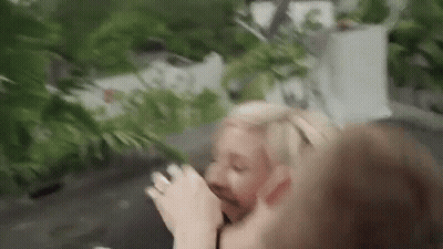Man And Woman Standing, Woman Drinking GIF
