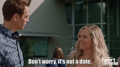 Man And Woman Standing, Woman Saying Don't Worry It's Not A Date GIF