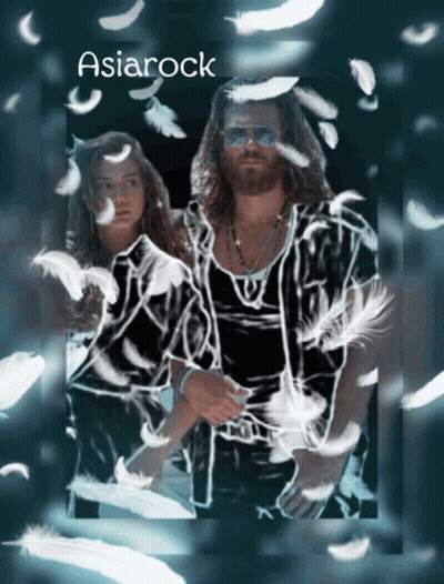Man And Woman Surrounded By Feathers GIF