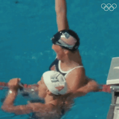 Man And Woman Swimming In Pool GIF