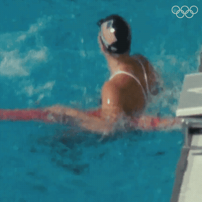 Man And Woman Swimming In Pool GIF