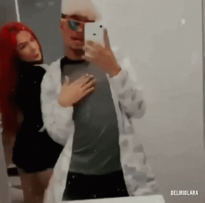 Man And Woman Taking Selfie In Mirror GIF