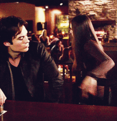Man And Woman Talking At Bar GIF