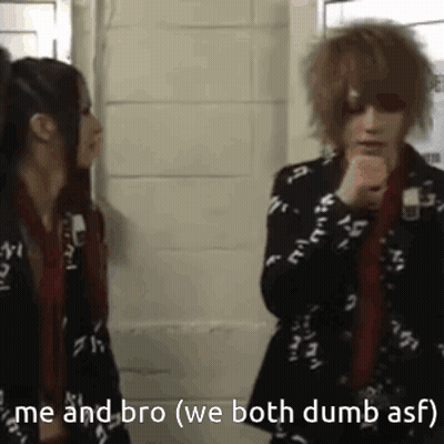 Man And Woman Talking By Brick Wall GIF