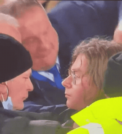 Man And Woman Talking In Crowd GIF