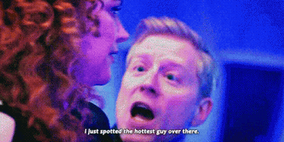 Man And Woman Talking In Dark Room GIF