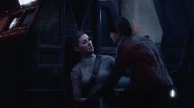 Man And Woman Talking In Dark Room GIF