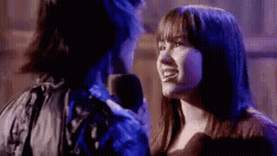 Man And Woman Talking In Dark Room GIF