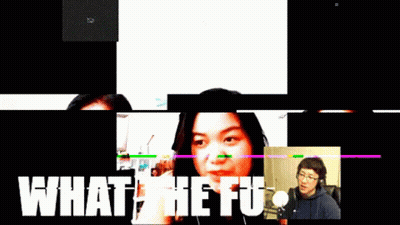 Man And Woman Talking In Front Of Screen Saying What The Fu GIF