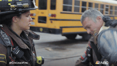 Man And Woman Talking In Front Of Yellow School Bus #Chicagofire GIF