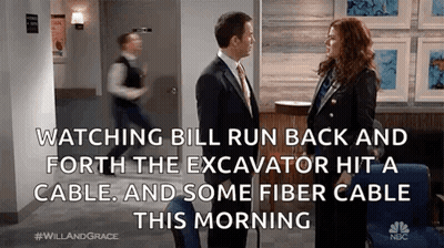 Man And Woman Talking In Hallway GIF