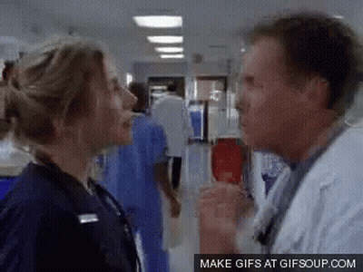 Man And Woman Talking In Hallway GIF