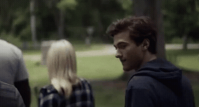 Man And Woman Talking In Park GIF