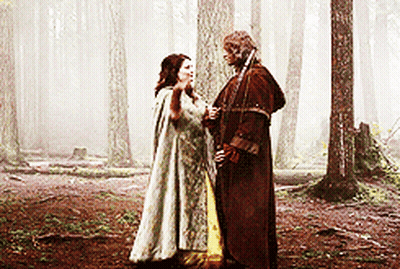 Man And Woman Talking In Woods GIF