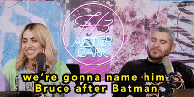 Man And Woman Talking Into Microphones In Front Of F3 After Dark Sign GIF