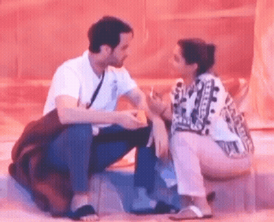 Man And Woman Talking On Bench GIF
