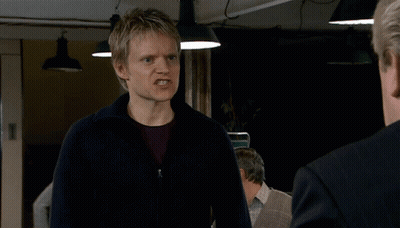Man And Woman Talking On Street Saying Give The People What They Want GIF